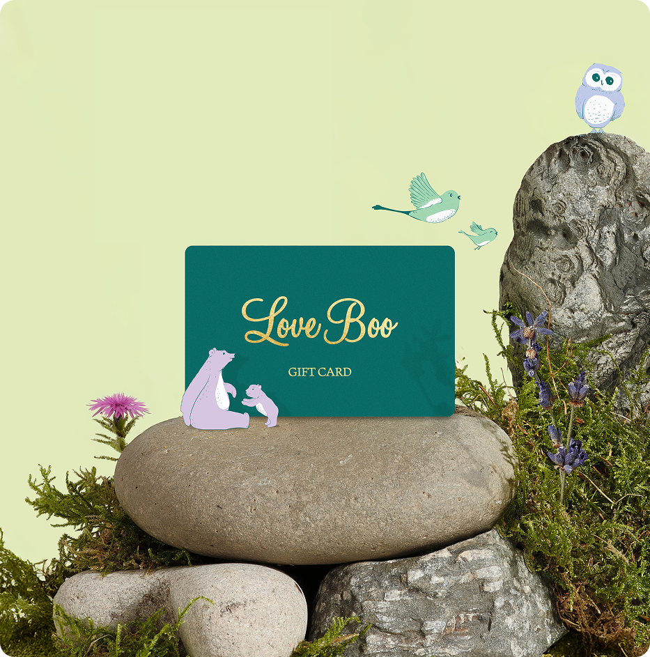 Gift card with 'Love Boo' on a stone surrounded by nature elements on a light green background