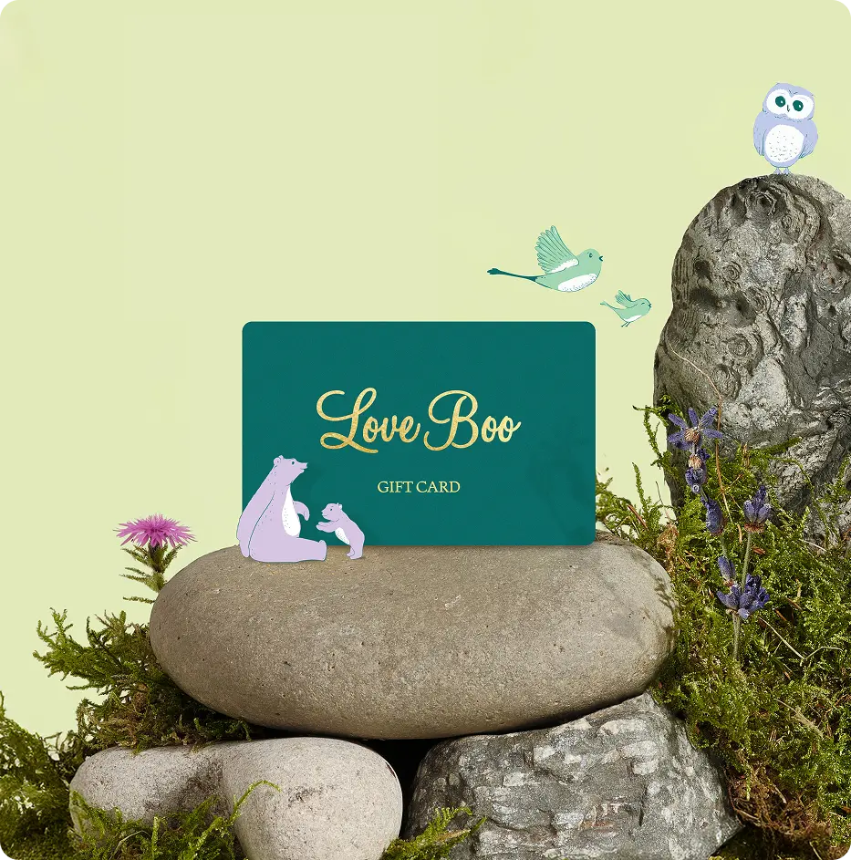 Gift card with 'Love Boo' on a stone surrounded by nature elements on a light green background
